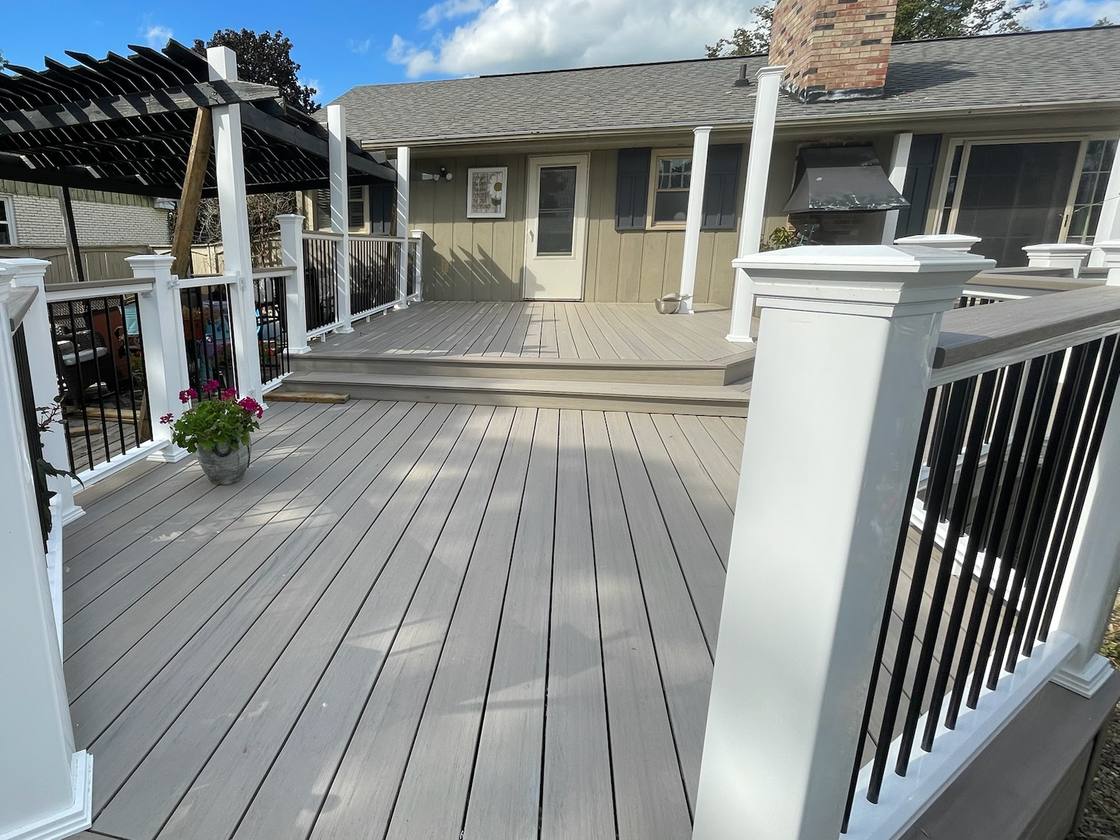 View across the composite deck toward its upper level and the house